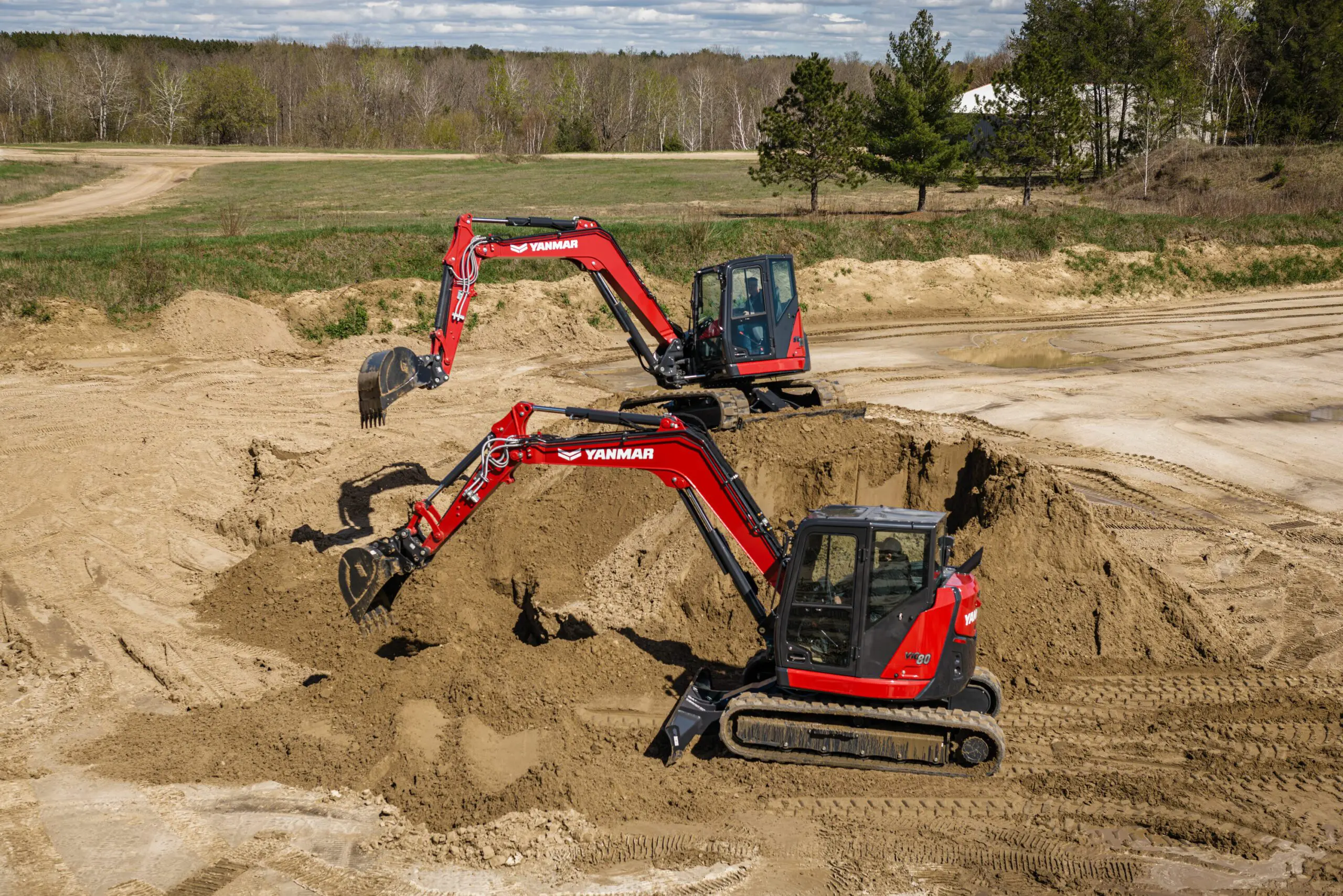 A pair of Mini Excavators ViO80-7 excavating.