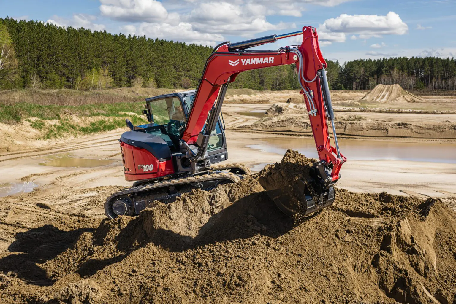 Mini Excavator SV100-7 excavating.